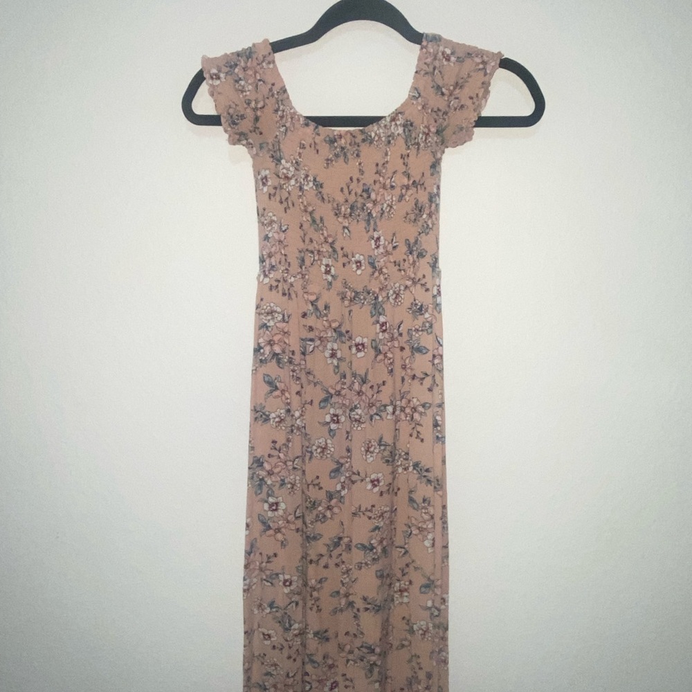 Floral off the shoulders maxi dress and it has a cut close to the left knee.